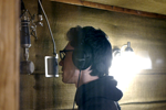 Dominick John laying down a track in the vocal booth.  Photo courtesy Dominick John.
