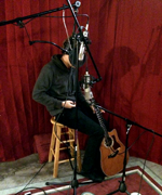 Some microphones being setup to capture a singer-songwriter. Photo courtesy 5j Barrow.